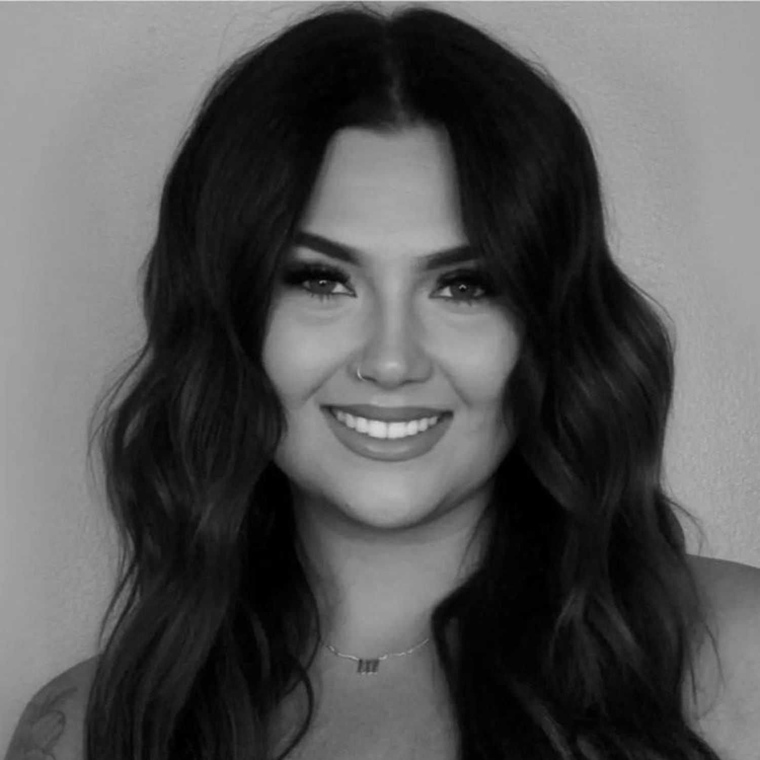 Portrait of MORGAN WHITE, a professional stylist at Cassandra Salon & Spa, showcasing their expertise and style.