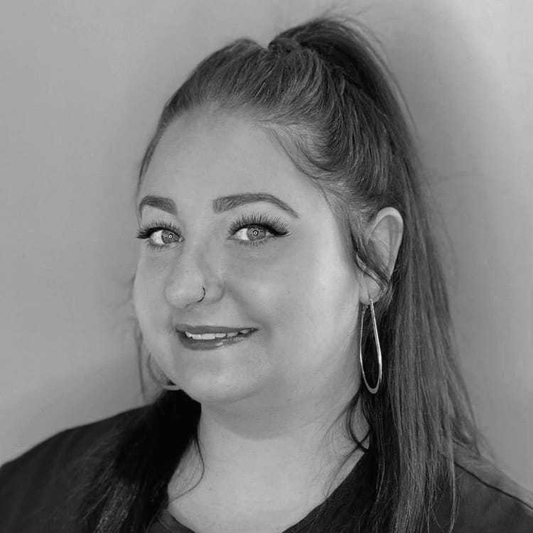 Portrait of BRITTNEY CAMPBELL, a professional stylist at Cassandra Salon & Spa, showcasing their expertise and style.