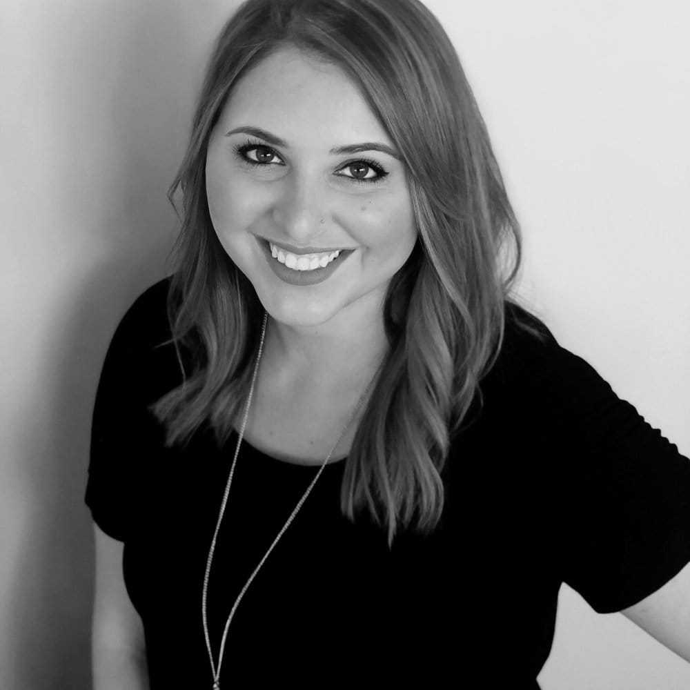 Portrait of AMBER FRIZZELL, a professional stylist at Cassandra Salon & Spa, showcasing their expertise and style.