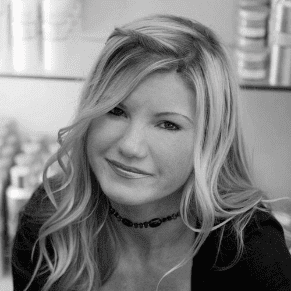 Portrait of DONNA DIONNE, a professional stylist at Cassandra Salon & Spa, showcasing their expertise and style.