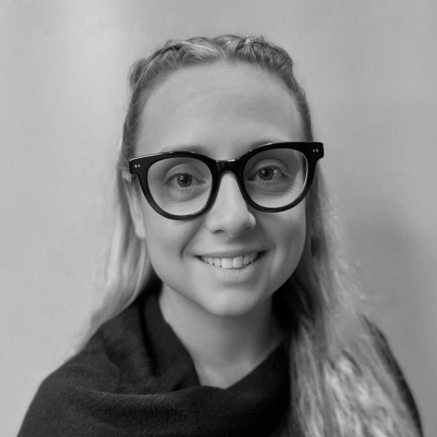 Portrait of DEBHINN WATTS, a professional stylist at Cassandra Salon & Spa, showcasing their expertise and style.