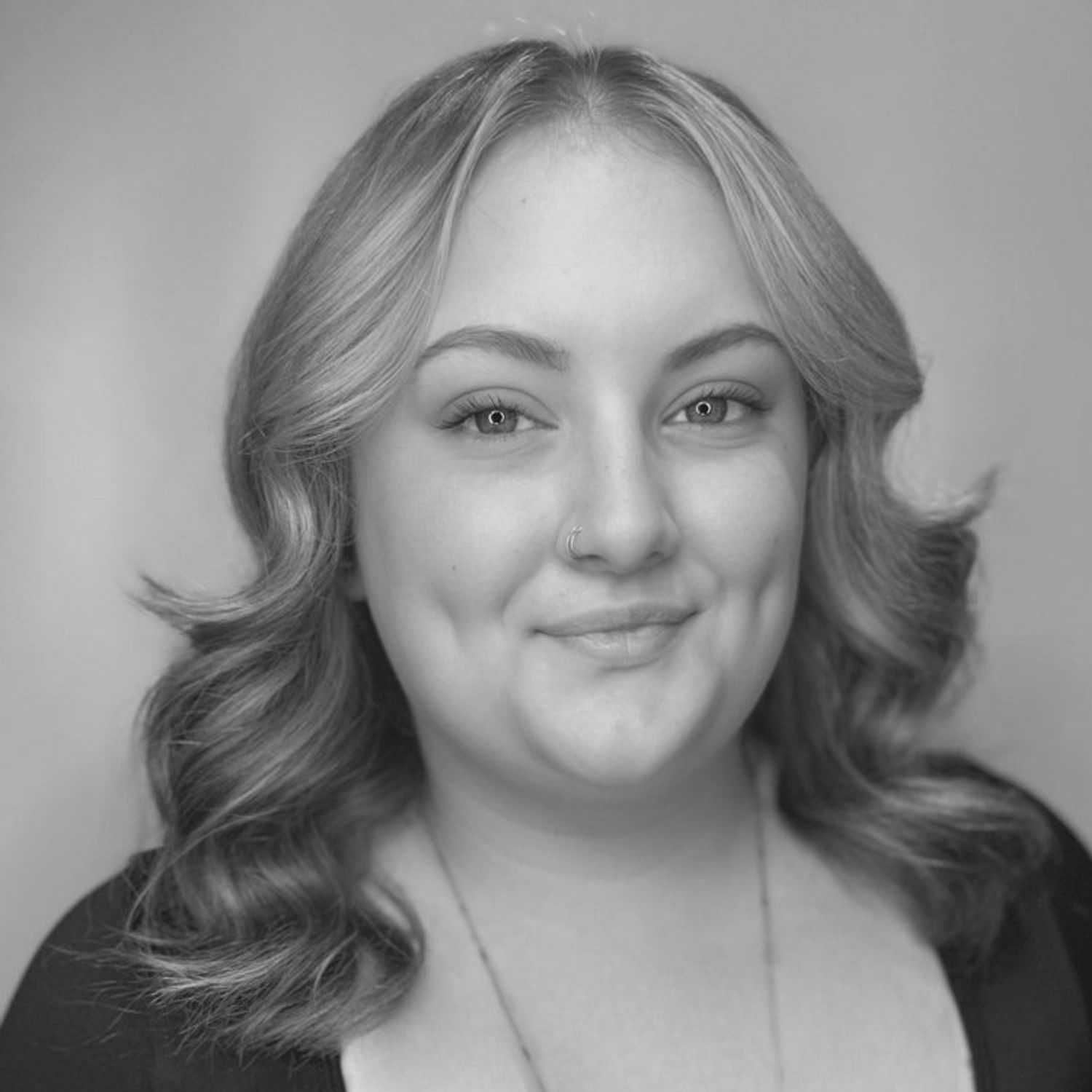 Portrait of SAVANNAH DOUGHERTY, a professional stylist at Cassandra Salon & Spa, showcasing their expertise and style.