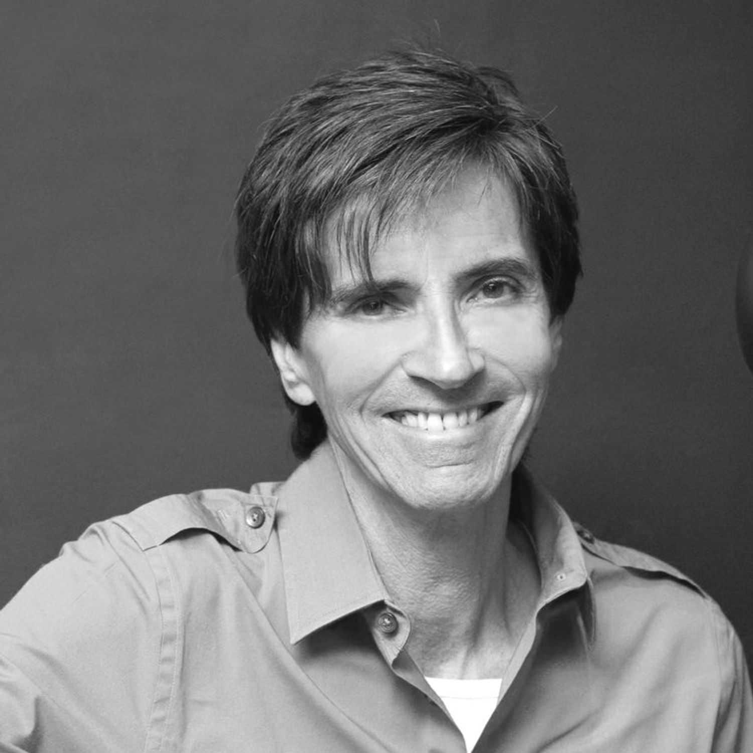 Portrait of JON MACDONALD, a professional stylist at Cassandra Salon & Spa, showcasing their expertise and style.